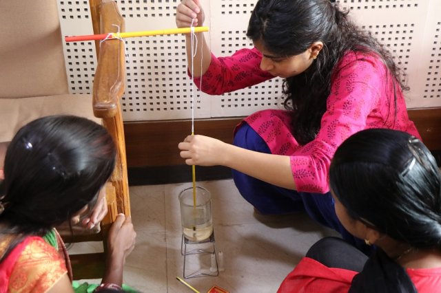 Resource person Honey helping the teachers.