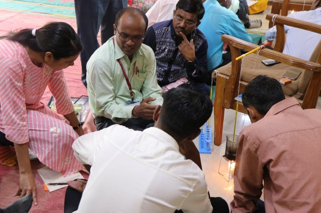 Teachers discussing on the practical.